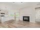 Bright open floor plan with fireplace and luxury vinyl plank flooring at 40 Tuskeegee Dr, Smithfield, NC 27577
