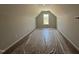 Spacious attic with a pitched ceiling, a window, and neutral carpet flooring at 41 W Emily Gardens Dr, Selma, NC 27576