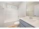 Neat bathroom with shower-tub combo, a single vanity, and a window for natural lighting at 41 W Emily Gardens Dr, Selma, NC 27576