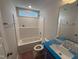 Bright bathroom featuring a shower-tub combo, modern toilet, and vanity with mirror at 41 W Emily Gardens Dr, Selma, NC 27576