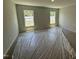 Well-lit bedroom with carpet, two windows, awaiting final touches for a cozy feel at 41 W Emily Gardens Dr, Selma, NC 27576