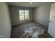 Cozy bedroom with a large window allowing ample natural light and neutral carpeting at 41 W Emily Gardens Dr, Selma, NC 27576