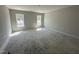 Bright, unfinished bedroom with two windows allowing natural light and plenty of space for furnishings at 41 W Emily Gardens Dr, Selma, NC 27576