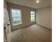 Cozy bedroom featuring plush carpet, natural light from the windows and neutral wall color at 41 W Emily Gardens Dr, Selma, NC 27576