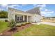 Beautiful house exterior showcasing a covered front porch and a two-car garage at 41 W Emily Gardens Dr, Selma, NC 27576