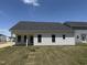 Charming single-story home showcasing a well-maintained backyard and classic white siding at 41 W Emily Gardens Dr, Selma, NC 27576