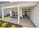 Welcoming covered front porch with stone accents and a stylish front door at 41 W Emily Gardens Dr, Selma, NC 27576