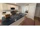 Kitchen featuring an island sink, stainless steel appliances, and ample white cabinetry for storage at 41 W Emily Gardens Dr, Selma, NC 27576