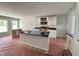 Bright kitchen with white cabinets, a dark countertop island, modern appliances, and natural light at 41 W Emily Gardens Dr, Selma, NC 27576