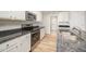Well-lit kitchen with stainless steel appliances, wood floor, and granite countertops at 41 W Emily Gardens Dr, Selma, NC 27576