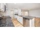Modern kitchen with granite counters, stainless steel appliances, and breakfast bar overlooking living room at 41 W Emily Gardens Dr, Selma, NC 27576