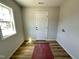 Convenient laundry room with a window, a door, and hook-ups for a washer and dryer at 41 W Emily Gardens Dr, Selma, NC 27576