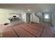 Bright, open-concept space showcasing the kitchen with white cabinets, opening into the living area at 41 W Emily Gardens Dr, Selma, NC 27576