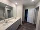 Bathroom with double sink vanity, white quartz countertop, and large mirror at 43 Chloe Ct, Selma, NC 27576