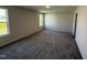 Bedroom featuring new carpet, neutral paint and lots of natural light from the windows at 43 Chloe Ct, Selma, NC 27576