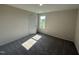 Cozy bedroom with neutral carpet and a window providing natural light at 43 Chloe Ct, Selma, NC 27576