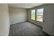 Bedroom featuring three windows, soft carpeting, and perfect amount of natural light at 43 Chloe Ct, Selma, NC 27576