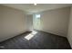 Bedroom with new carpet and neutral paint and a window for natural light at 43 Chloe Ct, Selma, NC 27576