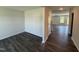 Open entryway with hardwood floors leading to a bright living space with neutral paint at 43 Chloe Ct, Selma, NC 27576