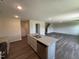 A kitchen island with a stainless steel sink, dishwasher, and granite countertops at 43 Chloe Ct, Selma, NC 27576