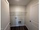 Laundry room with white walls, hardwood floors, and washer and dryer hookups at 43 Chloe Ct, Selma, NC 27576