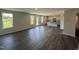 Spacious living room with hardwood floors, natural light, and an open kitchen at 43 Chloe Ct, Selma, NC 27576