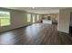Open concept living area features wood floor, plenty of light, and an eat-in kitchen with granite countertops at 43 Chloe Ct, Selma, NC 27576