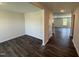 A bright living room features hardwood floors and lots of natural light from the windows at 43 Chloe Ct, Selma, NC 27576