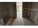 Unfinished bathroom featuring a shower stall and doorway to another room with natural light at 43 Chloe Ct, Selma, NC 27577