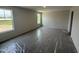 Bedroom with carpet, plastic covering, and windows providing natural light at 43 Chloe Ct, Selma, NC 27577