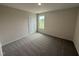 Serene bedroom with plush carpeting and sun-filled windows, creating a relaxing ambiance at 43 Chloe Ct, Selma, NC 27576
