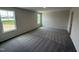 Cozy bedroom with soft carpeting and multiple windows, offering a comfortable retreat at 43 Chloe Ct, Selma, NC 27576