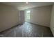 Bedroom with carpet, plastic covering, and a window view at 43 Chloe Ct, Selma, NC 27577