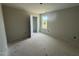 Spacious bedroom features a window and an open door, creating a comfortable and accessible layout at 43 Chloe Ct, Selma, NC 27577