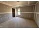 Unfinished bedroom featuring a window and a closet at 43 Chloe Ct, Selma, NC 27577