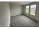 Bright bedroom with large windows offering natural light and comfortable carpet flooring at 43 Chloe Ct, Selma, NC 27576