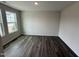 Bright bedroom with hardwood floors and large windows offering plenty of natural light at 43 Chloe Ct, Selma, NC 27576