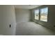 Sunlit bedroom with two windows, offering a bright and airy feel in this inviting space at 43 Chloe Ct, Selma, NC 27577