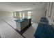 Modern kitchen island with a double sink, stylish faucet, and granite countertops at 43 Chloe Ct, Selma, NC 27577