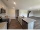 Kitchen featuring granite countertops, an island with a sink, and stainless steel appliances at 43 Chloe Ct, Selma, NC 27577