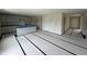 Open kitchen design with center island, gray cabinets, and granite countertops at 43 Chloe Ct, Selma, NC 27577