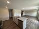 Kitchen island with granite countertops and stainless steel dishwasher, perfect for meal preparation at 43 Chloe Ct, Selma, NC 27576