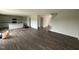 Open living room features hardwood floors, and white cabinets at 43 Chloe Ct, Selma, NC 27577