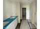 Bathroom featuring a double sink vanity, dark wood flooring, and a walk-in shower at 43 Chloe Ct, Selma, NC 27577