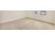 Cozy bedroom with neutral walls, plush carpeting, and natural light from two windows at 46 Lupin Dr, Smithfield, NC 27577