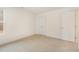 Carpeted bedroom with closet and natural light from a window at 46 Lupin Dr, Smithfield, NC 27577