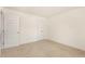 The bedroom features plush carpeting, neutral walls, a closet, and a second door at 46 Lupin Dr, Smithfield, NC 27577