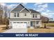 Charming two-story home with a two-car garage and stone accents at 46 Lupin Dr, Smithfield, NC 27577