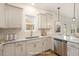 Bright kitchen features granite countertops, stainless steel dishwasher, and subway tile backsplash at 46 Lupin Dr, Smithfield, NC 27577