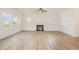 Spacious living room with a fireplace and large windows at 46 Lupin Dr, Smithfield, NC 27577
